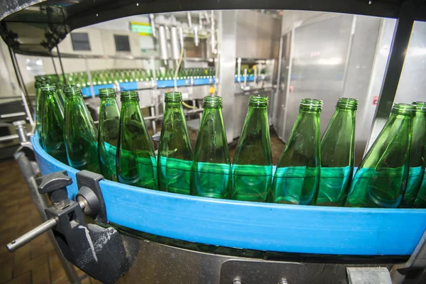 Bottles on conveyor belt