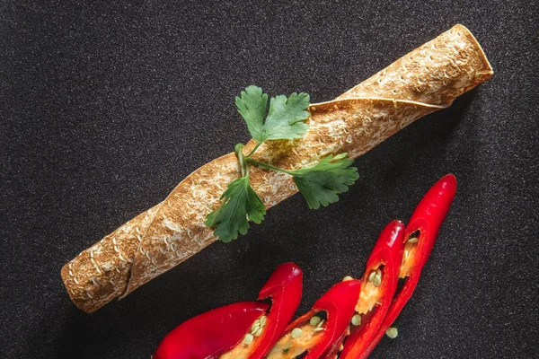 Roll from the Armenian lavash with spices, red pepper and a cori — Stock Photo, Image