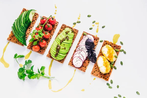 Easy sandwiches on the crackling wholegrain toast with avocado, Stock Picture