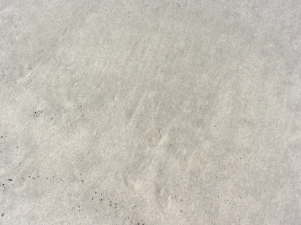 Крупный план текстуры пляжного песка — стоковое фото