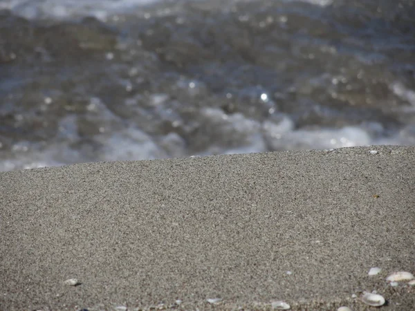 Primer plano de playa de arena con fondo borroso —  Fotos de Stock