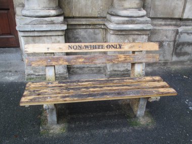 A bench in Cape Town during the apartheid period placed outside the High Court Civil Annex. Even benches were reserved to whites only of non white only clipart