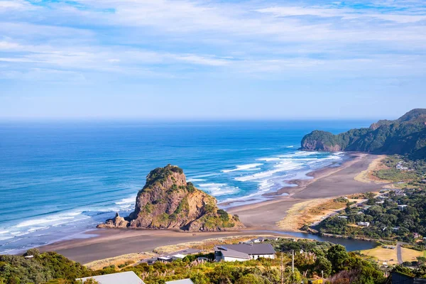View of Piha beach and Lion Rock in summer day light