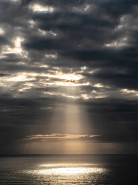 Aerial view of gray evening clouds over Tasman sea horizon