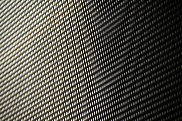 規則的なパターンと影を持つ金属メッシュのビュー — ストック写真