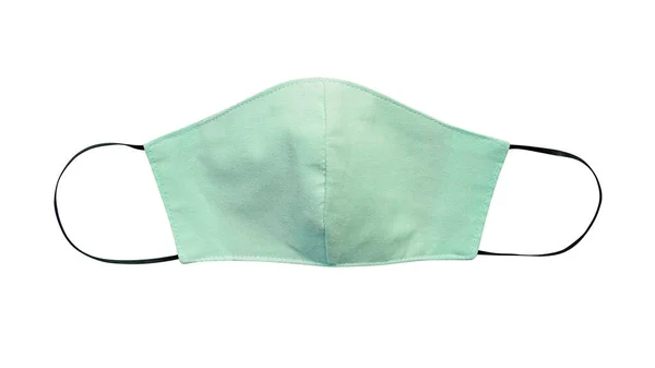 Green pastel cloth face mask isolated on white background with clipping path. Due to lack of medical protective masks during Coronavirus (COVID-19) pandemic, healthy people instead wear cotton masks. — Stock Image Green Pastel Cloth Face Mask Isolated White Background Clipping Path Stock Picture