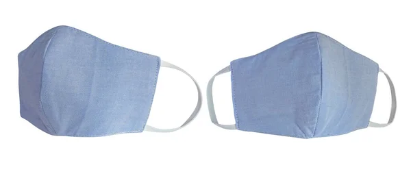 Light blue pastel cotton cloth face masks isolated on white with clipping path. Due to lack of medical protective masks during Coronavirus (COVID-19) pandemic, regular people instead wear cotton masks — Stock Image Light Blue Pastel Cotton Cloth Face Masks Isolated White Clipping Stock Image
