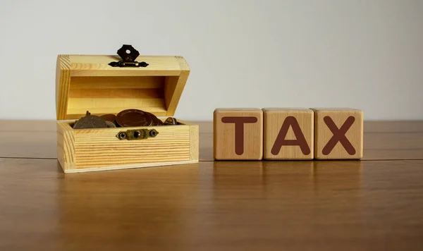 Concept Word Tax Cubes Beautiful Wooden Table Small Chest Coins — Stock Photo, Image