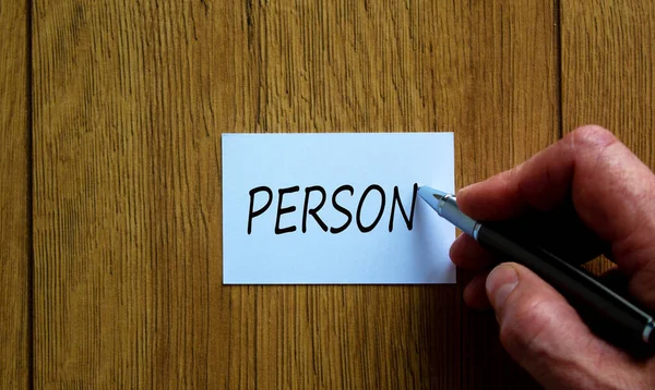 Male Hand Writes Words Person White Card Beautiful Wooden Table — Stock Photo, Image