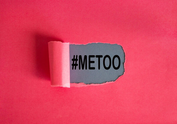 The text '#metoo' appearing behind torn pink paper. Beautiful background, copy space.