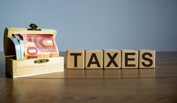 Concept Word Taxes Cubes Beautiful Wooden Table Small Chest Euro — Stock Photo, Image