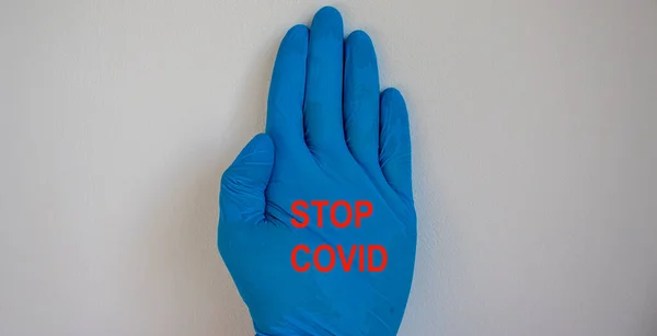 Doctor Hand Sterile Blue Gloves Stop Covid Inscription — Stock Photo, Image