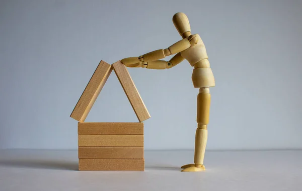 Wooden Man Builds Model Wooden House Place Your Text — Stock Photo, Image