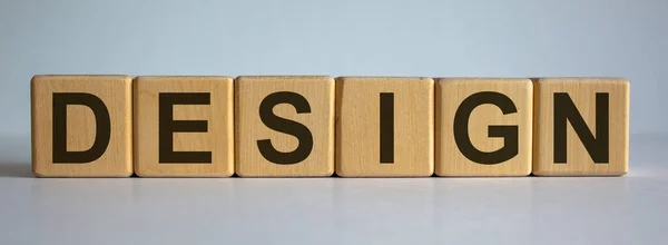 Concept word 'design' on cubes on a beautiful white background.