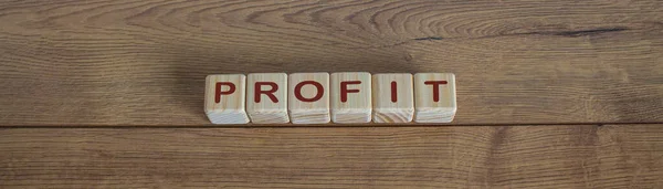 concept word profit on cubes on a beautiful wooden table