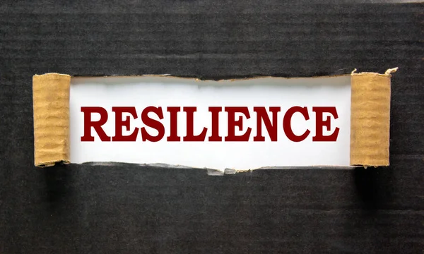 Texto Resiliencia Que Aparece Detrás Del Desgarrado Papel Negro —  Fotos de Stock