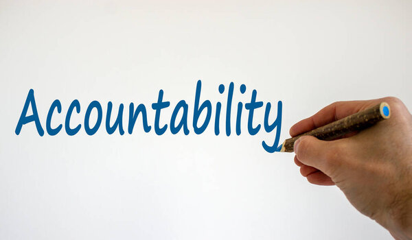 Hand writing 'accountability', isolated on beautiful white background. Concept. Copy space.