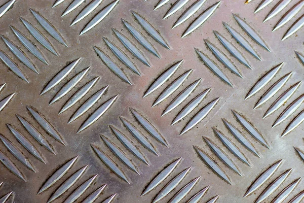 Corrugated metal sheet close up. White Checker Plate abstract floor metal stanless background stainless pattern surface.