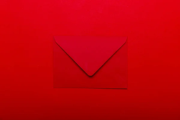 Opened red envelope. Blank envelope on dark red background.