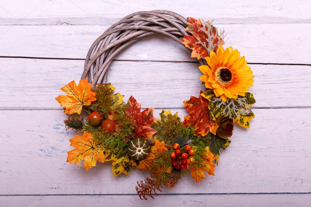 Autumn wreath on wooden background. Thanksgiving concept. Copyspace