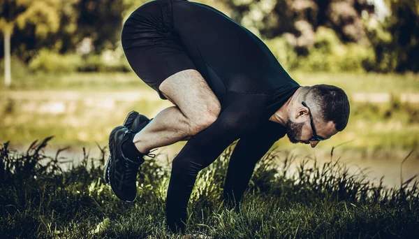 Man Stretching Hands Legs Green Grass Park Athlete Workout Outdoors — Stock Photo, Image