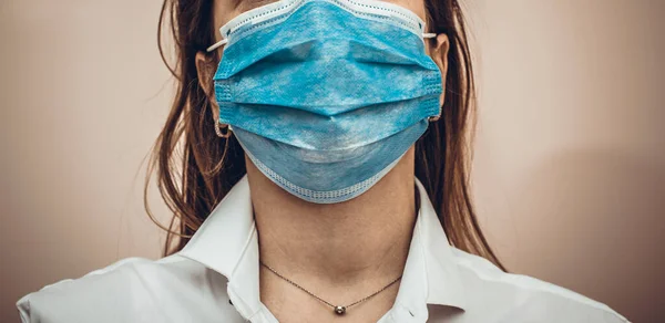 Doctor or nurse wearing protection face mask against coronavirus. Banner or panorama view for coronavirus or covid-19 ncov. Stay home and pray concept. High resulotion image.