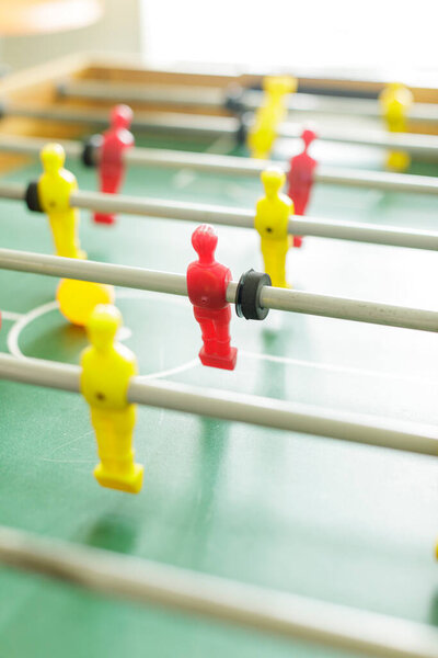 Close up of table football. Red and yellow table soccer players. High resulotion image.