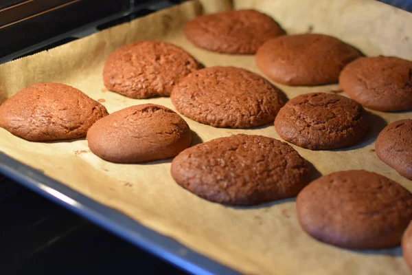 Baking cinnamon gingerbread. Gingerbread cookies on a baking sheet in the oven.