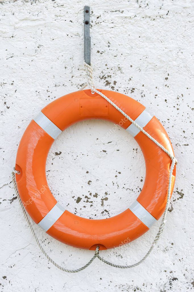 Lifebuoy hanging on an old harbour building