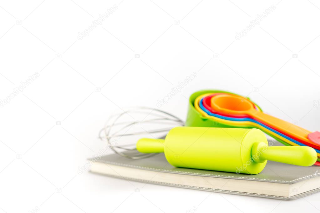 Baking tools and different shapes on white background on white background.