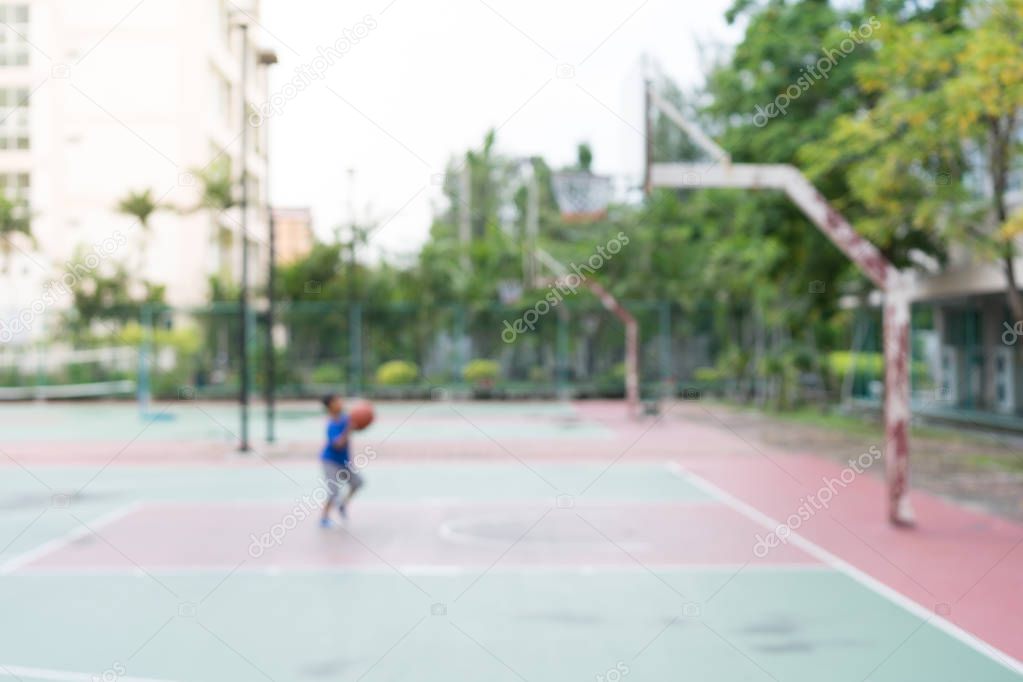 blur of children playing basketball