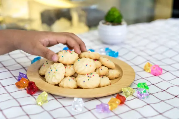 Pile of cookies on wooden plate — Stock Photo, Image