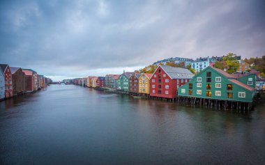Colorful houses at the river Nidelva in Trondheim at the Trondheim fjord clipart