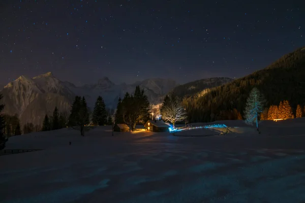 Snowshoe walk during winter wonderland at night on the Tschengla in Austria