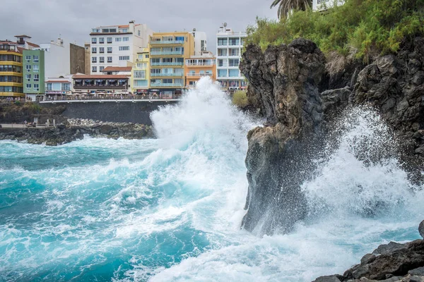 Waves from Atlantic are breaking at stone walls at the bay of Martianez in Puerto de la Cruz on Tenerife, Canaria Islands, Spain
