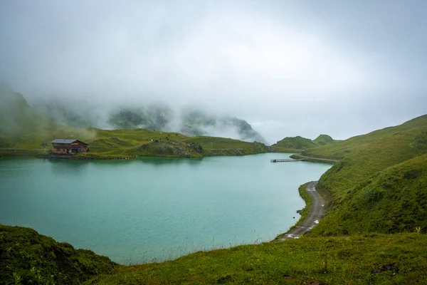 Wonderful nature with fog and rain at the Zuerser See in Vorarlberg, Austria