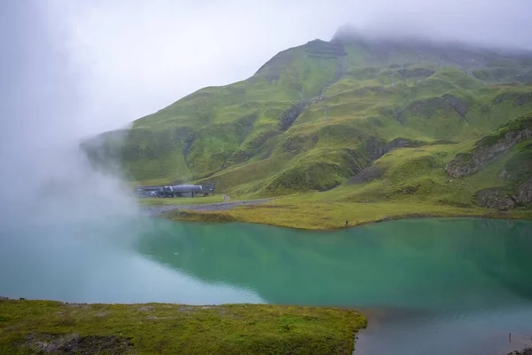 Wonderful nature with fog and rain at the Zuerser See in Vorarlberg, Austria