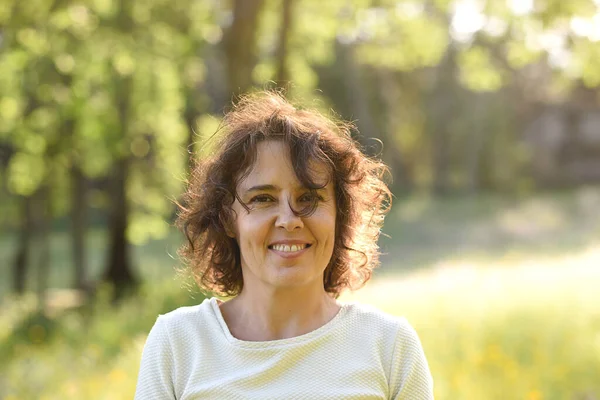 Portrait of woman in nature with sunlight and spirit lifestyle.