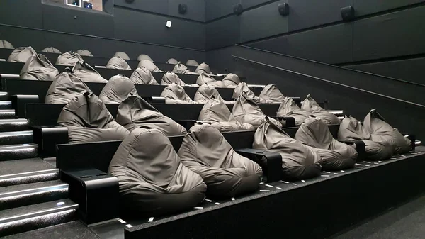 Empty rows of seats in the cinema. Convenient bags for cinema seating. Social distance, ban on events