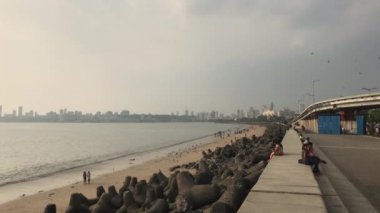 Mumbai, India - November 10, 2019: Marine Drive tourists on the waterfront in Bombay is located in the Bay of Beck Bey in the Arabian Sea part 3
