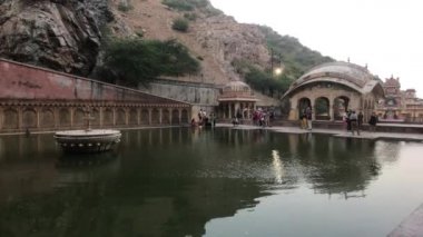 Jaipur, India, November 04, 2019 Galta Ji, tourists hold abluising ceremonies on the other side of the pool