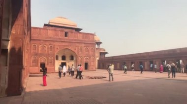 Agra, India, November 10, 2019, Agra Fort, tourists walk along the red brick structure part 4
