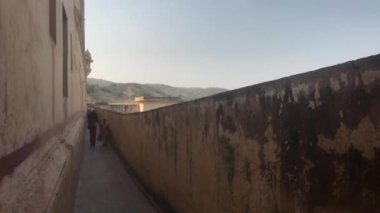 Jaipur, India, November 05, 2019, Amer Fort tourists walk along the long balcony of the fortress