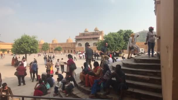 Jaipur, India, November 05, 2019, Amer Fort, tourists inspect the old buildings around them part 8 — Stock Video