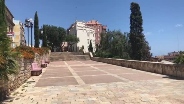 Tarragona, Spain, A path with trees on the side of a building — Stock Video