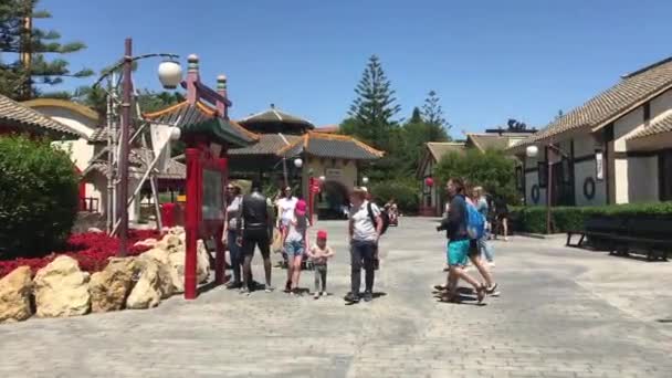 Salou, Spain, A group of people walking outside of a building — Stock Video