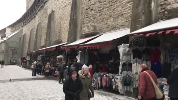 Tallinn, Estonia, February 18 2017: A group of people walking down a street — Stock Video