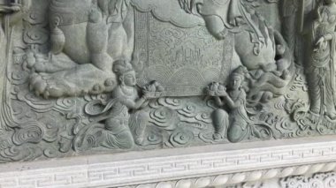 Hong Kong, Çin, taştan bir heykel.