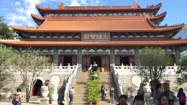 Hong Kong, China, November 20 2016: A large building with Po Lin Monastery in the background — Stock Video