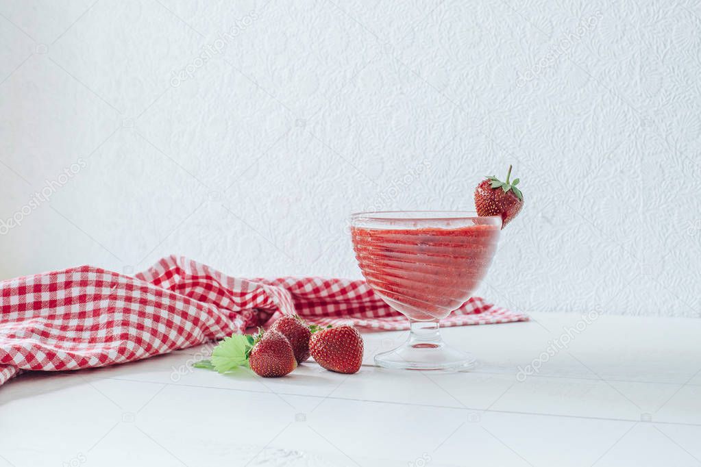 Puree fresh strawberries. White table. Red cloth. Healthy breakfast. Smoothies. Healthy Eating.